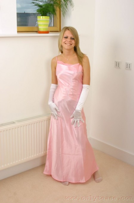 Sammy Jo in long white gloves wears long pink dress that hides her killer lingerie